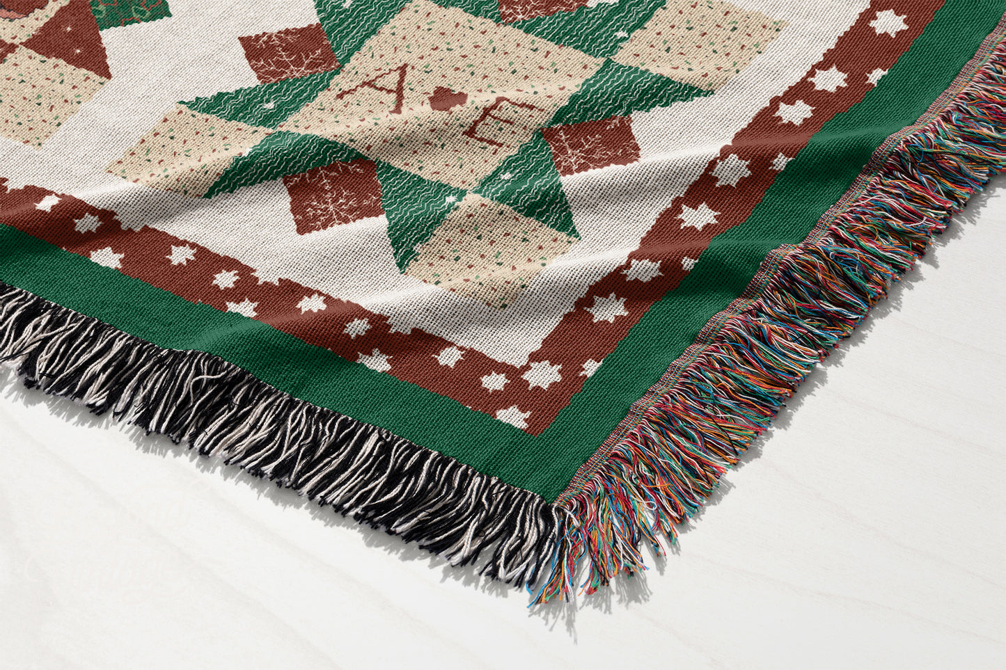 a blanket with a christmas tree on it