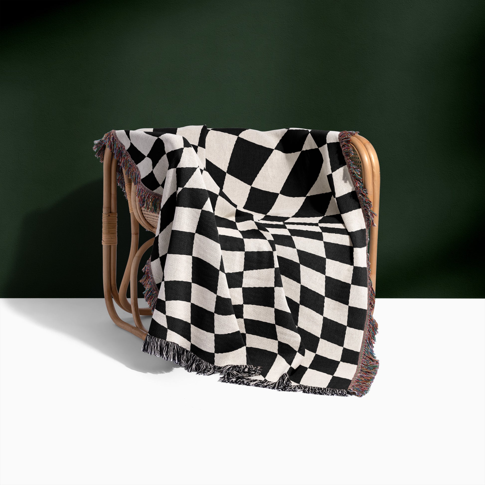 a black and white checkered blanket on a chair