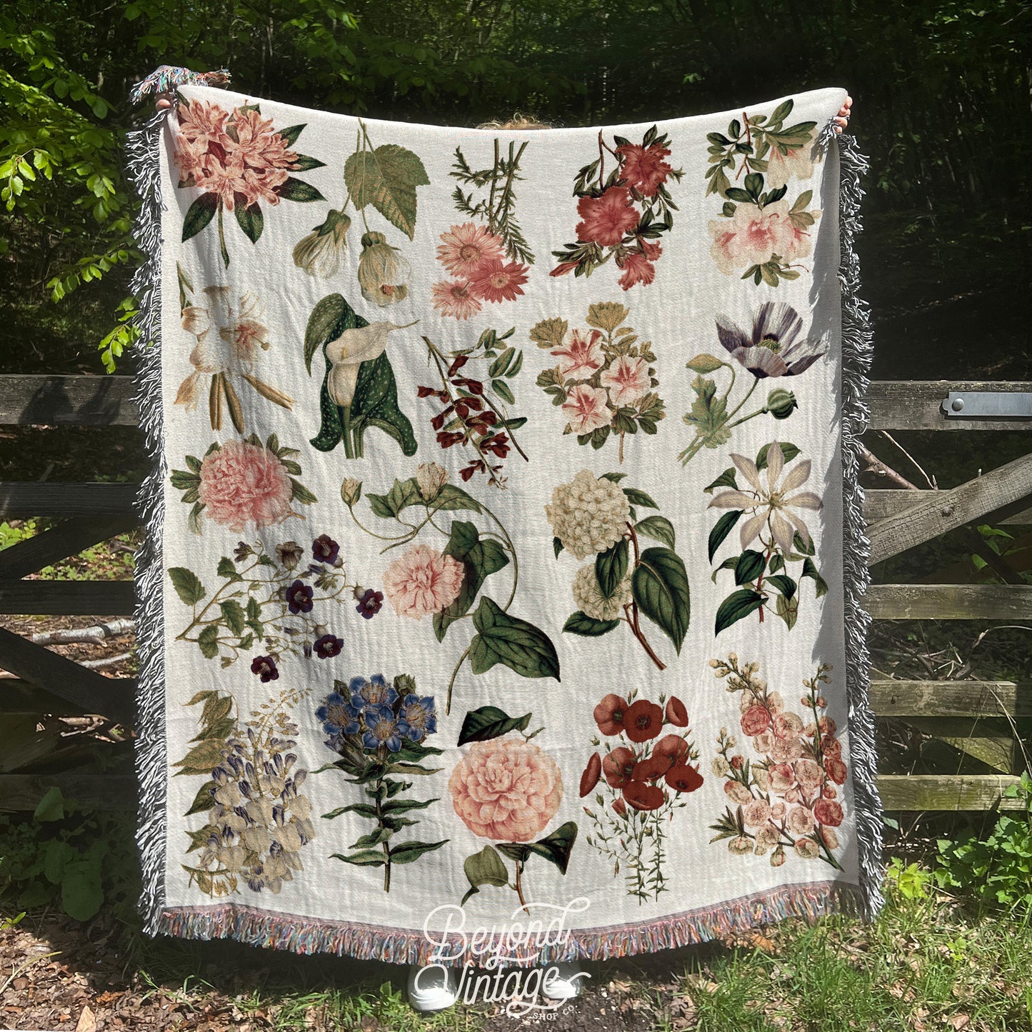 a blanket with a bunch of flowers on it