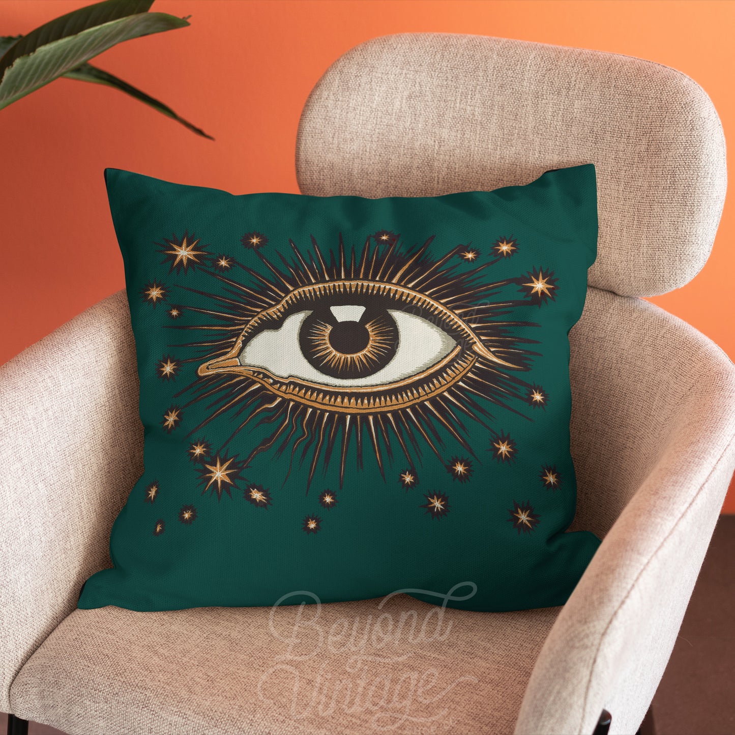 a green pillow with an eye on it