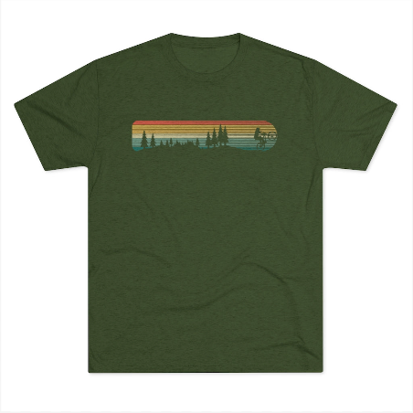 a green t - shirt with a sunset and trees on it