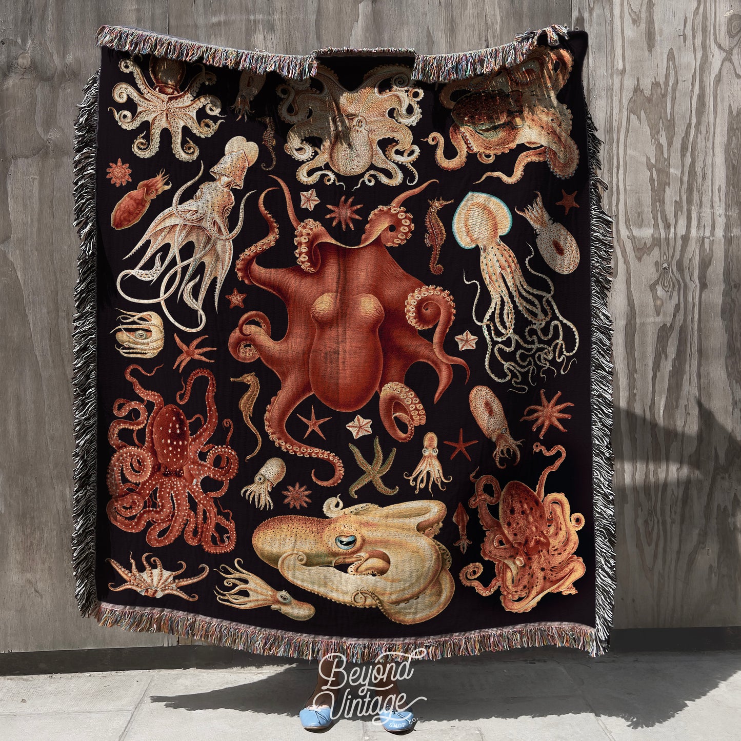 a blanket with an octopus and other sea creatures on it