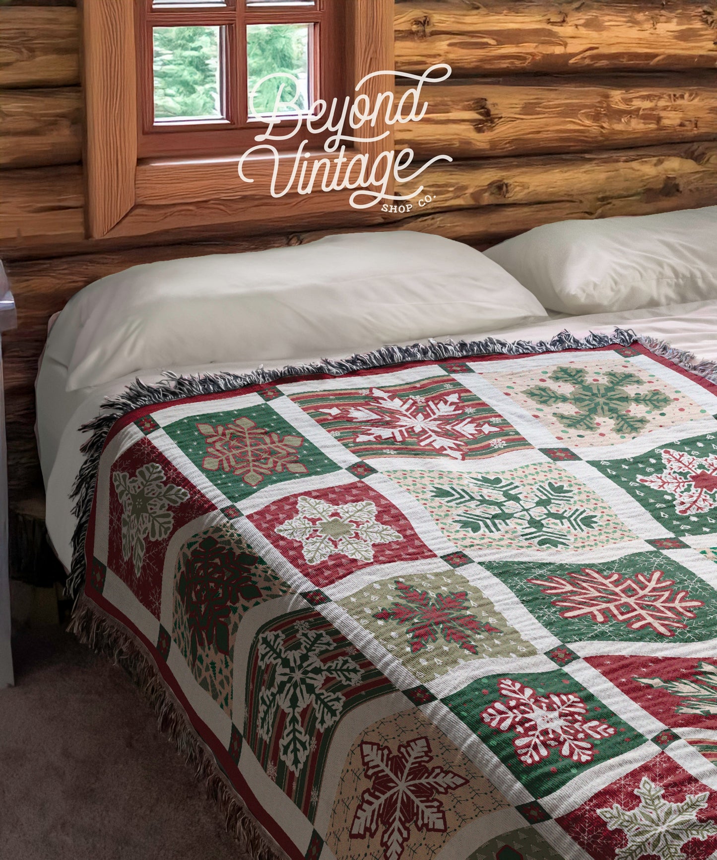 a bed with a quilt on top of it next to a window