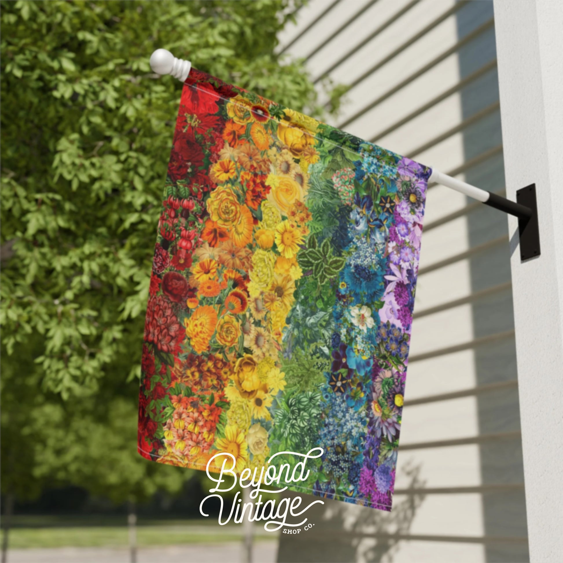 a colorful quilt hanging on a clothes line