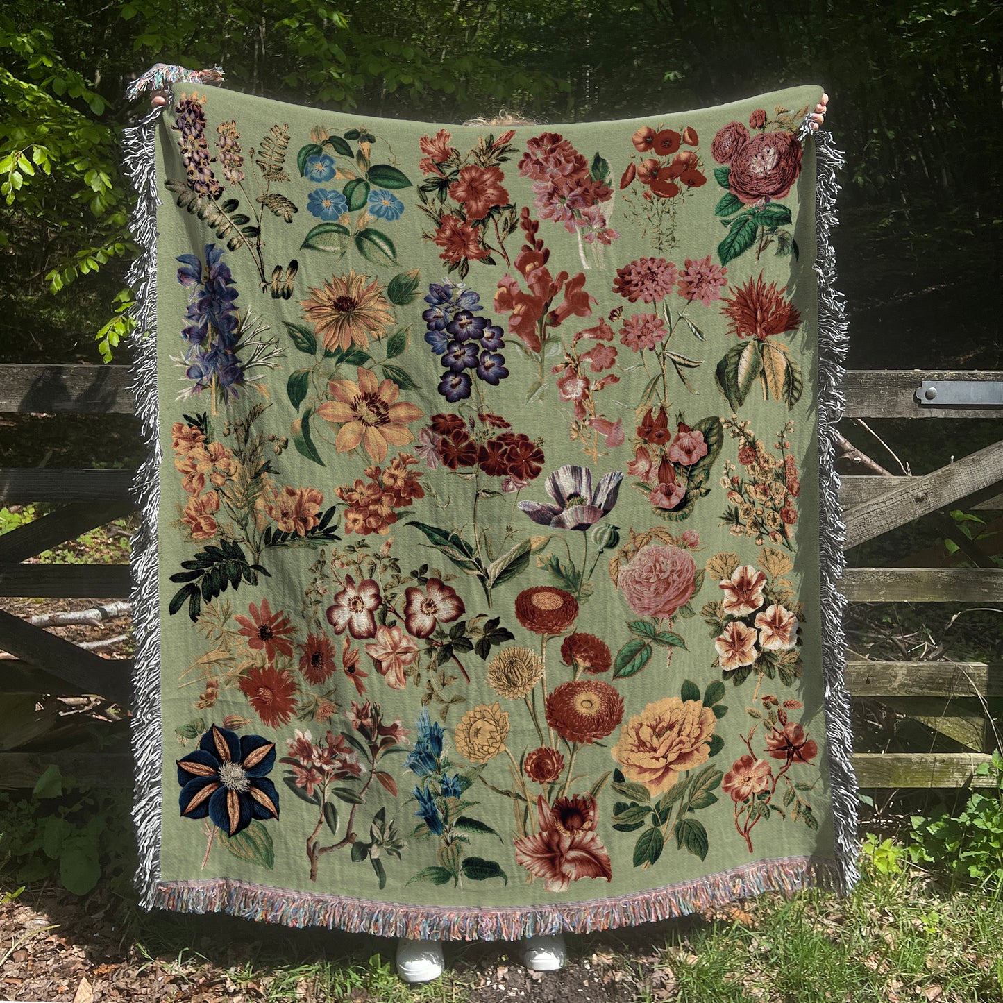 a blanket with a bunch of flowers on it