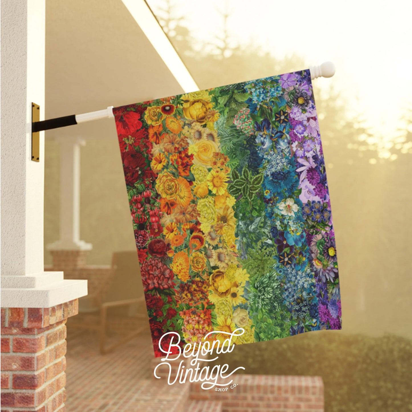 a multicolored quilt hanging on a clothes line