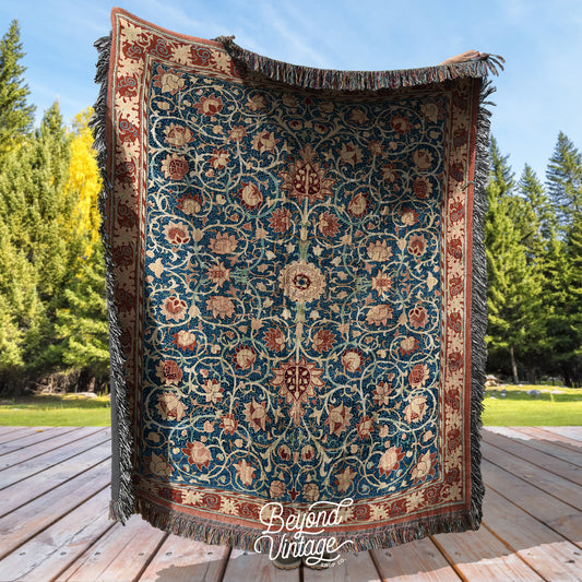 a large blue and red rug sitting on top of a wooden floor