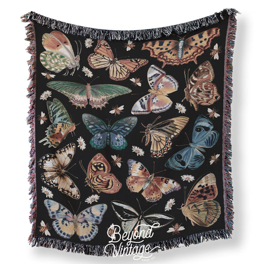 a blanket with a bunch of butterflies on it