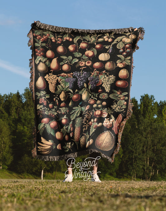 a blanket with a picture of fruit on it