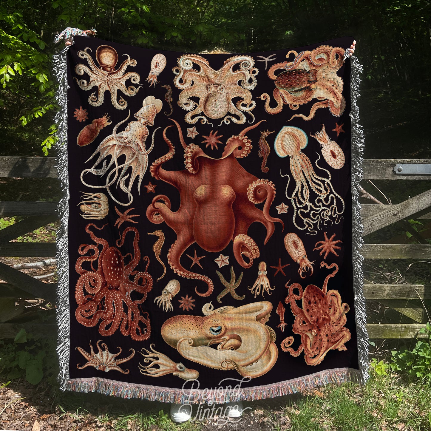 a blanket with an octopus and other sea creatures on it