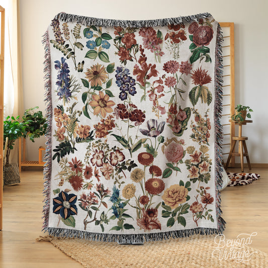 a blanket with a bunch of flowers on it