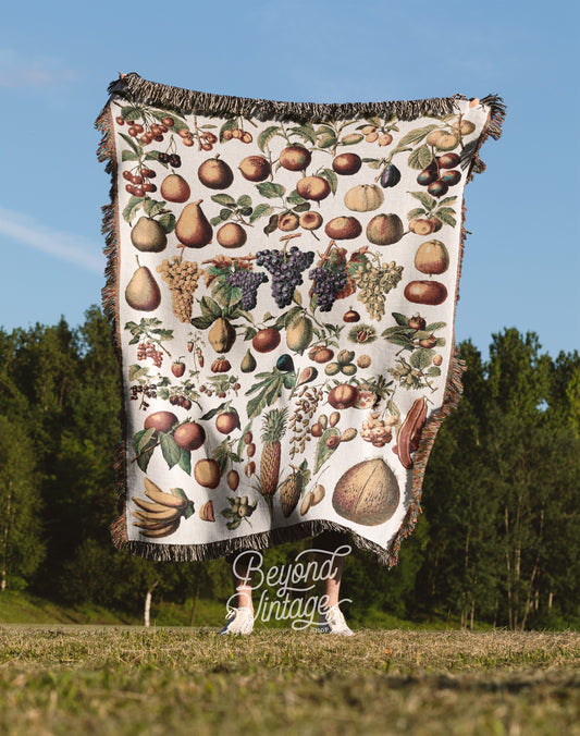 a blanket with a bunch of fruit on it