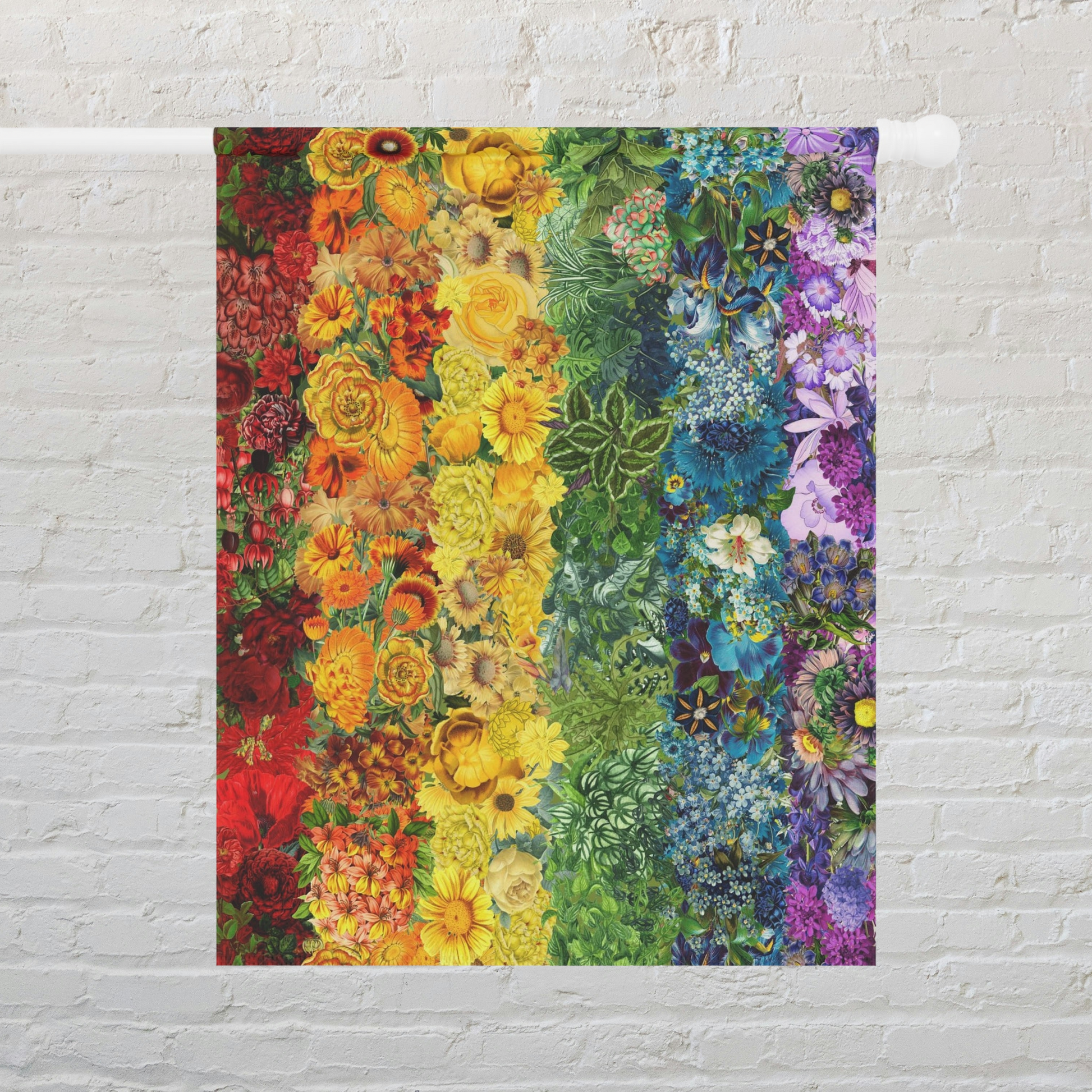 a multicolored painting of flowers on a brick wall