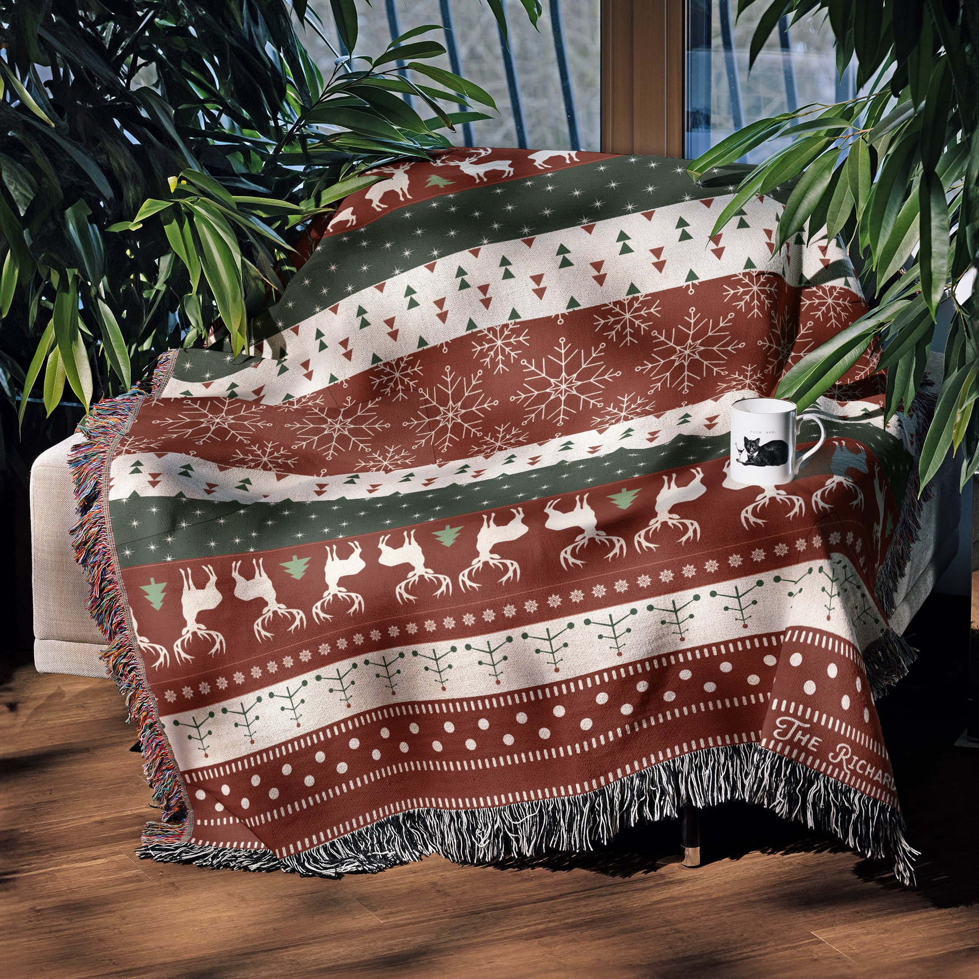 a blanket sitting on top of a wooden floor next to a window