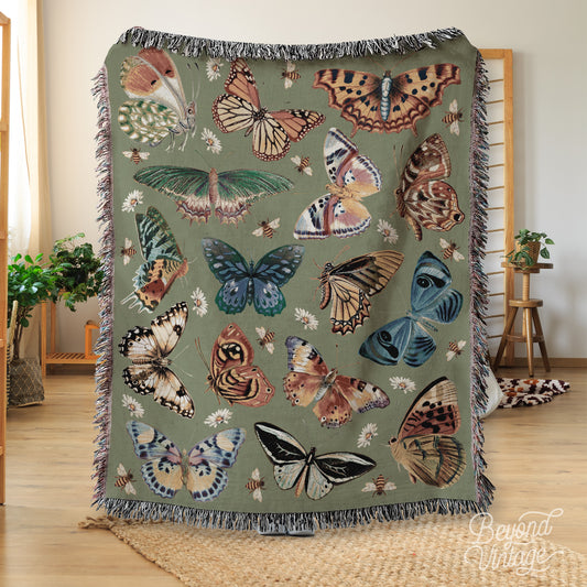 a blanket with a bunch of butterflies on it