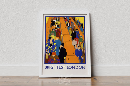 a framed poster of a crowded train station