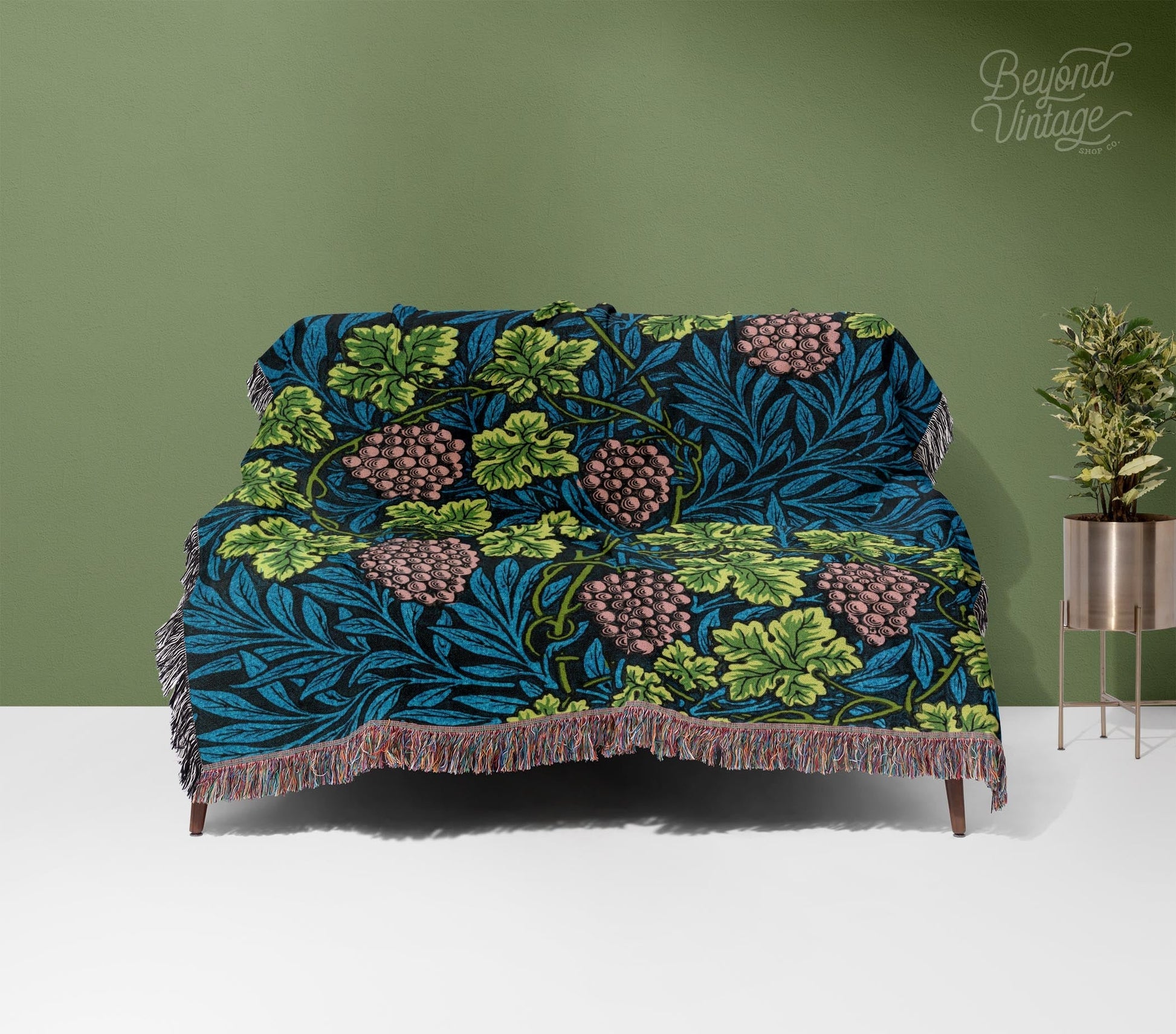 a couch with a blue and green floral design on it