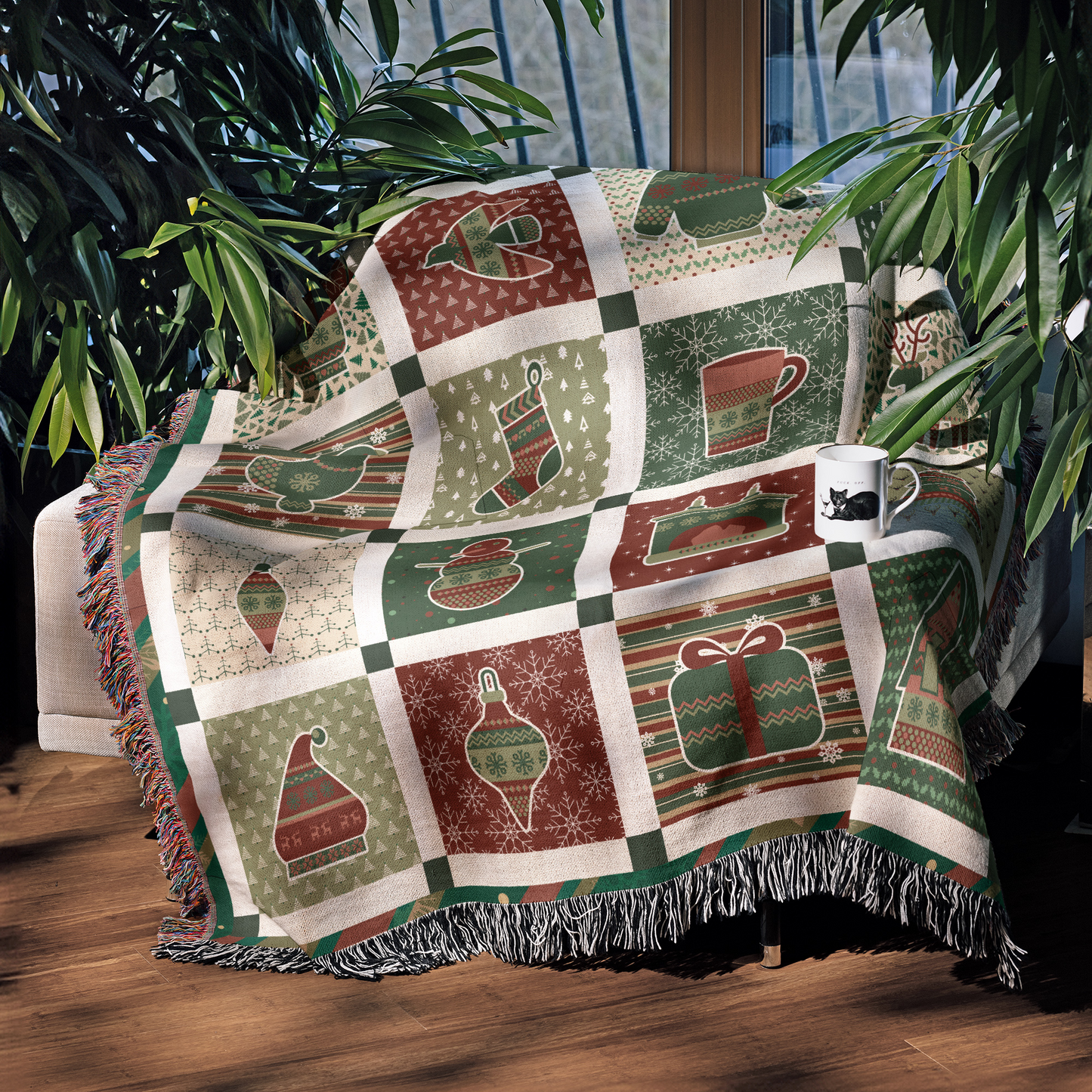 a green and red quilt sitting on top of a wooden floor