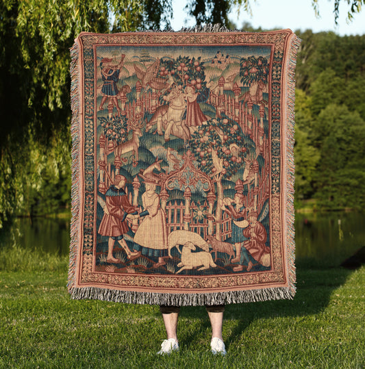a woman holding a tapestry of a medieval scene