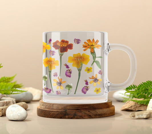 a coffee mug with flowers painted on it
