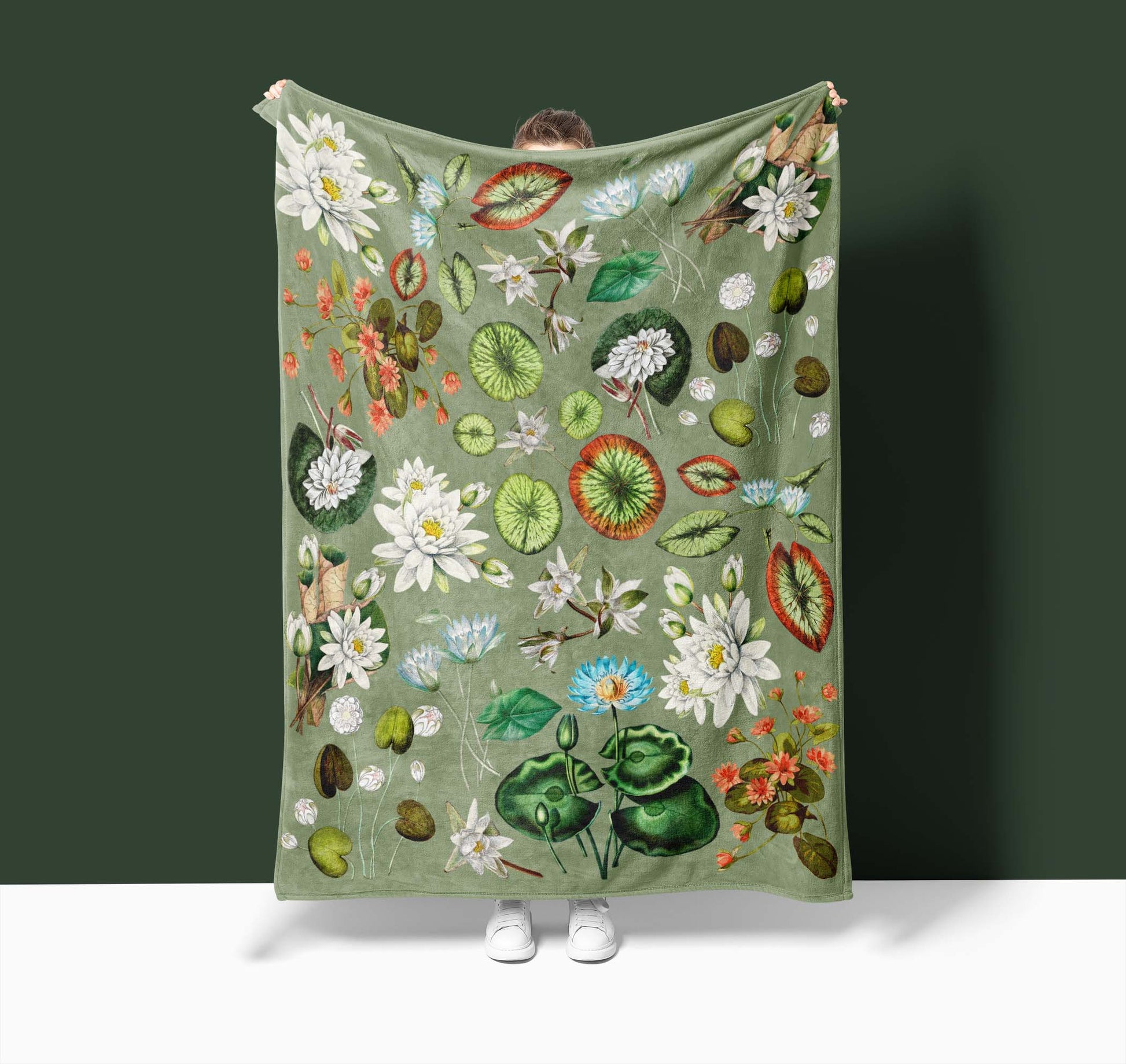 a green wall hanging with a flower and leaf design