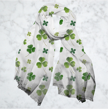 a scarf with four leaf clovers on it