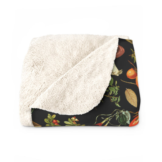 a blanket with a black and white floral pattern