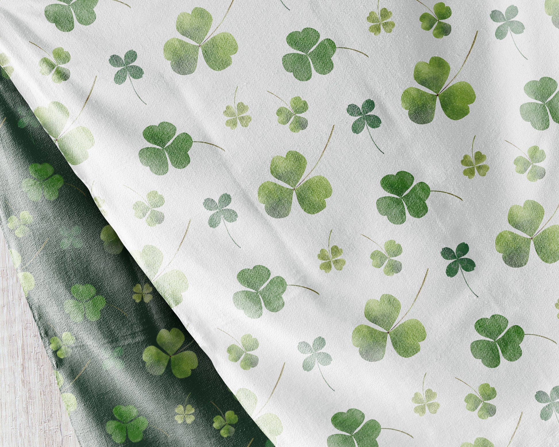 a close up of a sheet with shamrocks on it